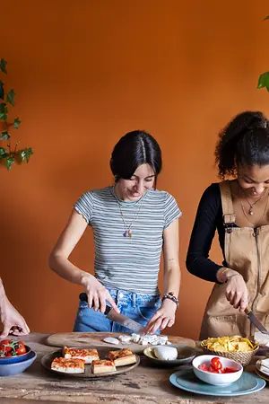 A group of students making food together
