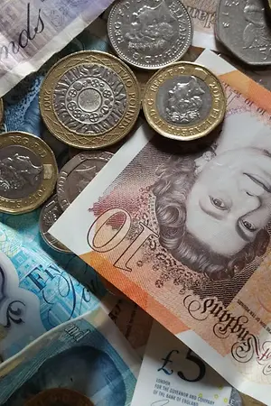 A pile of coins and banknotes