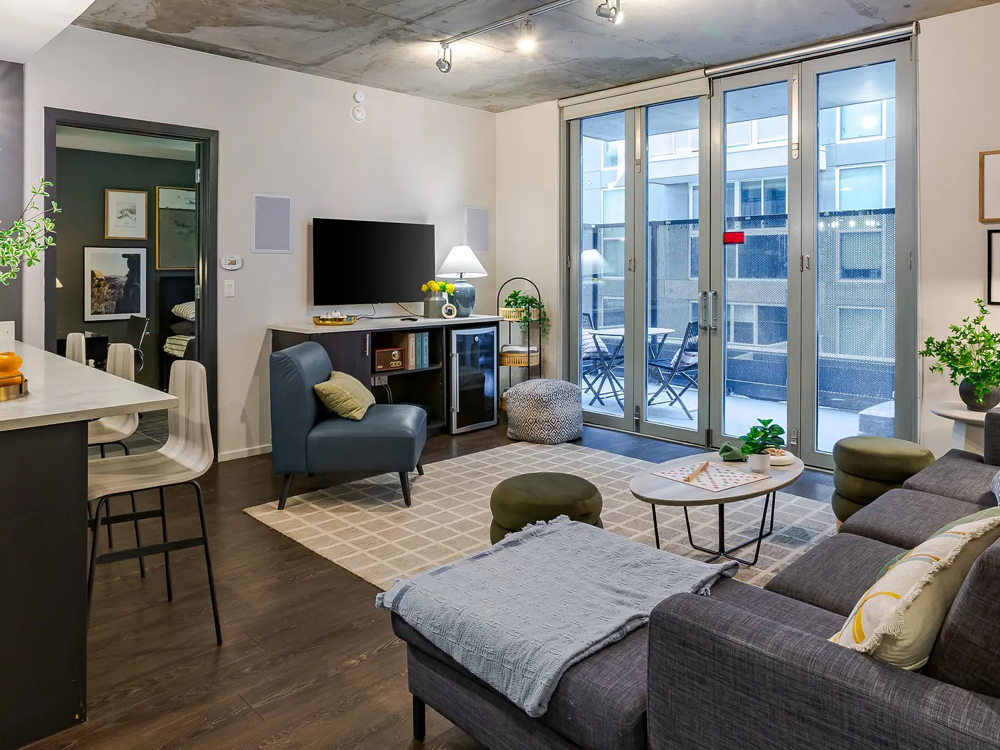 Model living room opening onto a balcony.